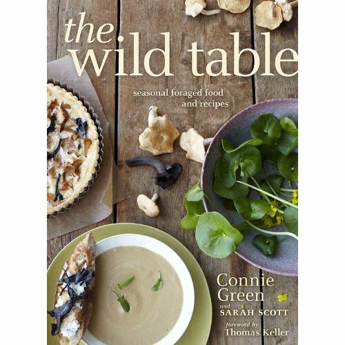 Photo of wild foods on table with mushroom soup illustrating the new cookbook the wild table.